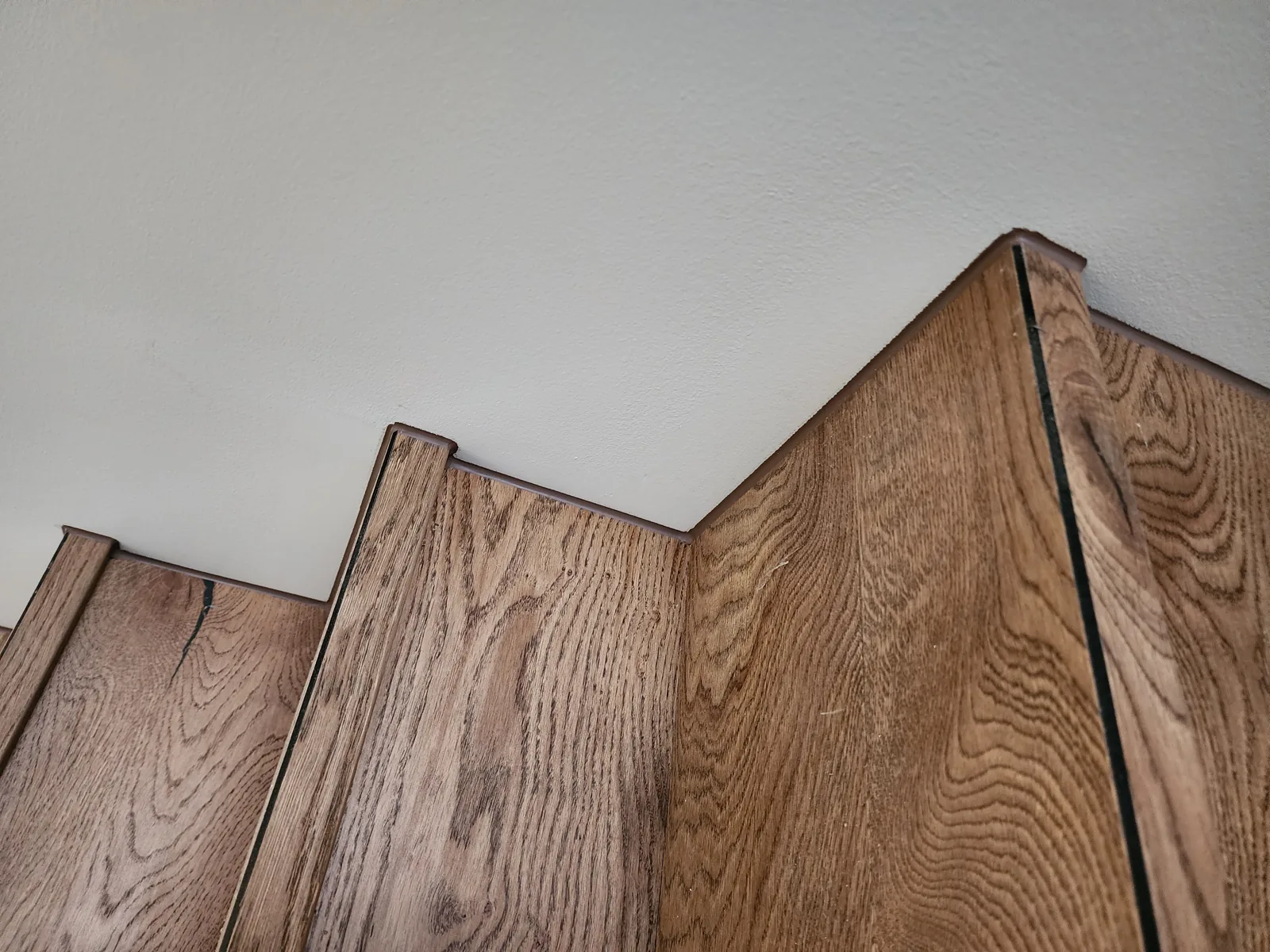 Timber staircase skirting with a neat finishing caulk line, Melbourne new build